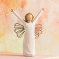 Willow Tree Courage, 6”h hand-painted standing resin angel figure in cream dress with wire wings, both arms upraised, in front of orange painting