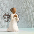 Willow Tree Angel of the Spirit, 4"h hand-painted resin kneeling figure with darker skin and hair, cream dress with wire wings, looking upwards with hands in prayer position. Silver painting in background