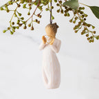 Front view of Dated Ornament: figure holding wire heart with 2025 written in it; loop and hook in head