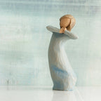 Willow Tree Journey, 5.5”h hand-painted standing resin figure in blue dress, arms raised up to face as if dancing, in front of blue/grey painting