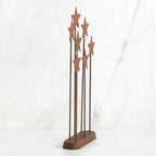 Bronze plaque with star stands on top of it