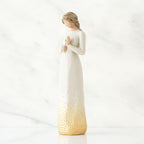 Brunette girl figurine in white dress holding arms up