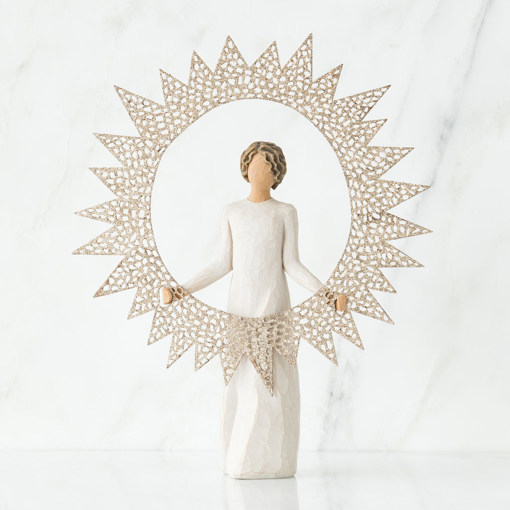 Brunette girl figurine in white dress standing facing forward holding large sun figurine