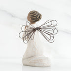 Small brunette girl figurine in white dress kneeling with brown wire wings