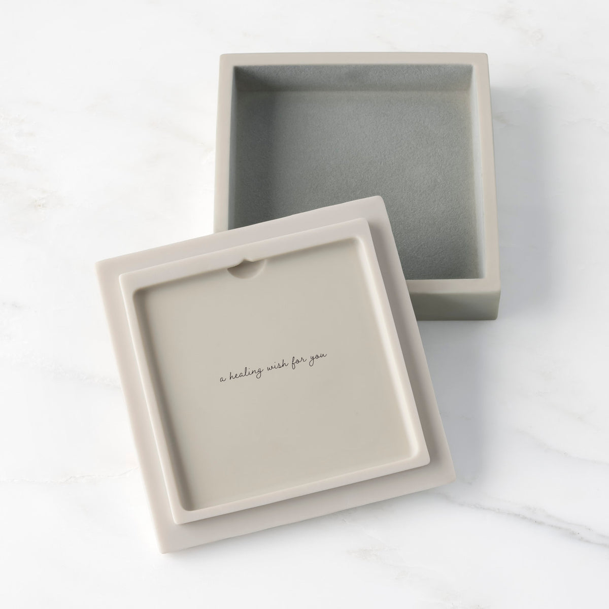 White resin box with detached lid showing sentiment on lid back; velvety gray-green finish in box base