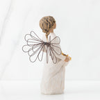 Back view of angel with tied back, curly, dark brown hair holding up a portion of her dress's skirt as it is full of sunflowers