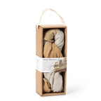 Cardboard package containing 2 ft by 5 ft gauze fabric with gradation of color along length of mustard to sand to mustard, to use under Nativity. Wraparound label features nativity display