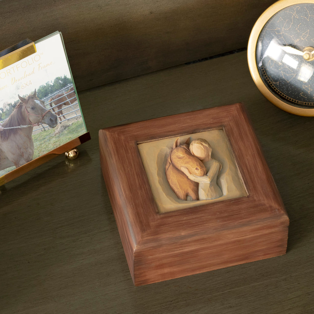 Willow Tree Quiet Strength Memory Box, 4.75” sq x 2”h  hand-painted red-brown wood box with bas-relief resin carving of girl in green dress, arms embracing horse on hinged lid