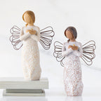 Lighter &amp; Darker skin versions of angel with wire wings, arms crossed over gold heart, carved with symbols of remembrance