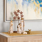 Display of Nativity figures atop gradated mustard color table runner, 2 ft by 5 ft gauze fabric, shown on top of cabinet