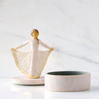 Front view: open oval resin box, showing detached lid with figure next to box base