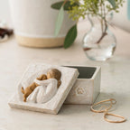 Willow Tree Friendship True Box, 3”sq x 2”h hand-painted resin box with removable lid off to one side, jewelry inside box. Lid has bas-relief carving of seated figure in cream dress, playing with yellow dog, inside of box has sentiment