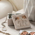 Willow Tree Friendship Keepsake Box, 3”sq x 2”h hand-painted resin box with removable lid off to one side, jewelry inside box. Lid has bas-relief carving of two seated figures in cream dresses, facing each other, inside of box has sentiment