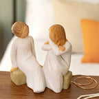 Willow Tree Heart and Soul, 4"h hand-painted resin figure of two women in cream dresses, facing, seated on gray bench, on wooden shelf