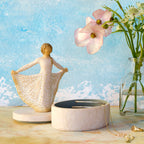 Willow Tree Butterfly Keepsake Box, 6.5"h x 4.5"h hand-painted oval resin box, 4.75”h figure holding cream skirt with carvings of monarch butterfly affixed to lid, open with jewelry inside
